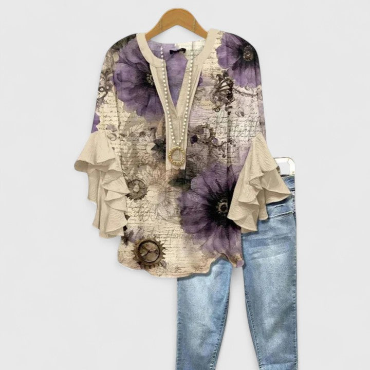 Plus size women's comfortable blouse with floral print and elegant ruffle sleeves for everyday style.