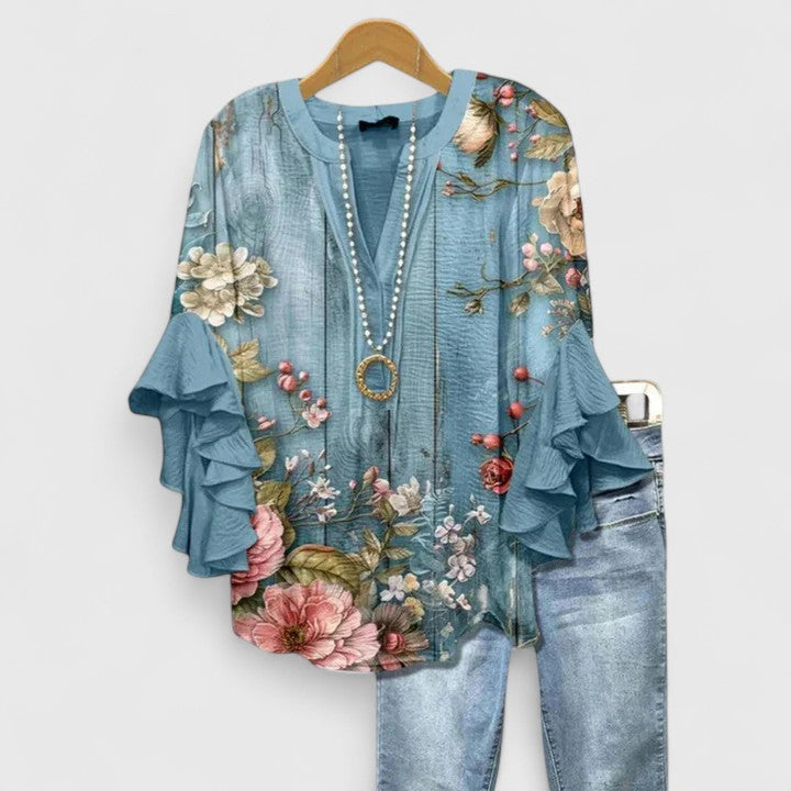 Chic women's comfortable top, floral print with pretty ruffle sleeves for effortless style.