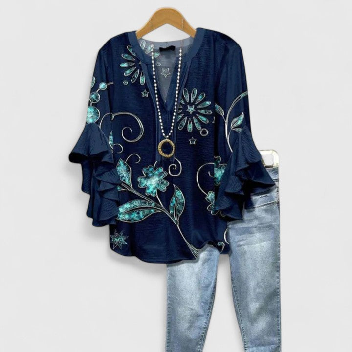 Fashionable women's blouse, comfortable fit, beautiful floral pattern and trendy ruffle sleeves.