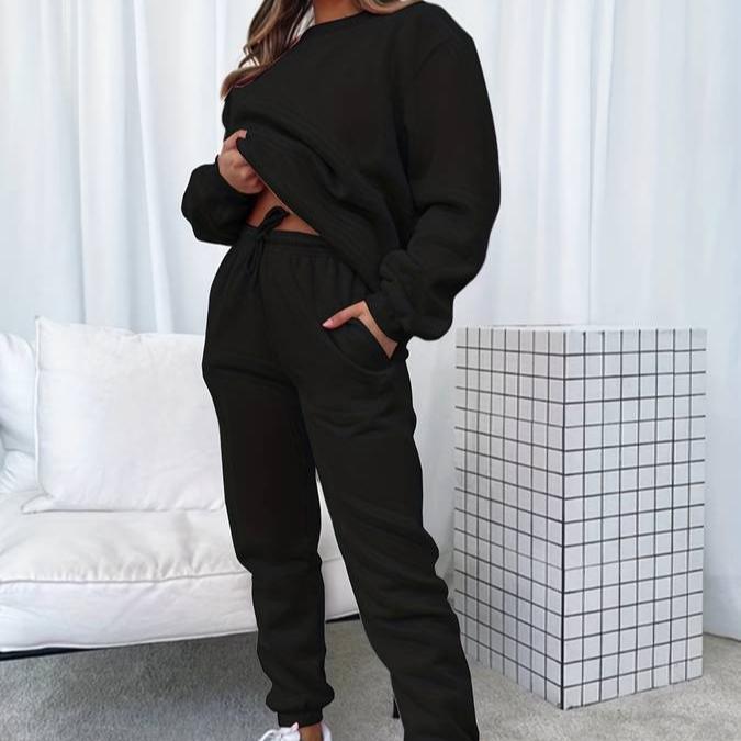 Women's comfortable gray sweatshirt and jogger lounge set, perfect for casual wear.