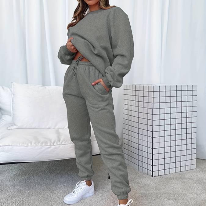 Versatile women's apparel: a comfortable sweatshirt and jogger lounge set in a neutral color.