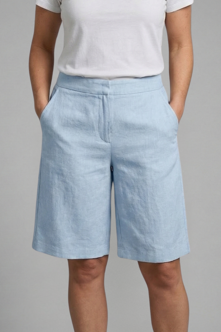 Women's versatile knee-length shorts, elastic waist, side pockets, relaxed fit for summer casual wear.