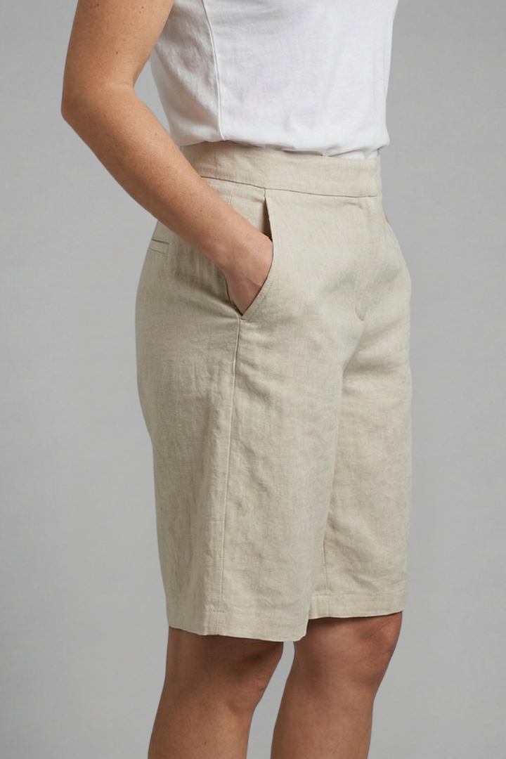 Versatile women's knee-length shorts with elastic waist, drawstring, & side pockets for everyday comfort.