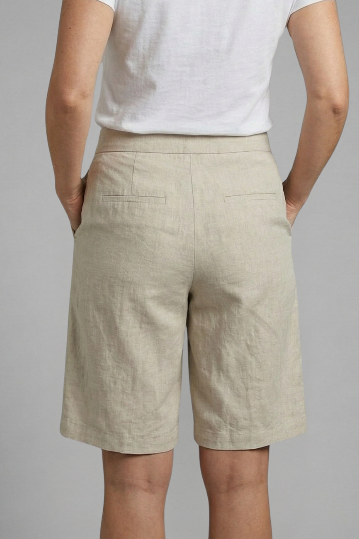 Relaxed fit women's shorts, knee-length, with an elastic waist, drawstring, & functional side pockets.