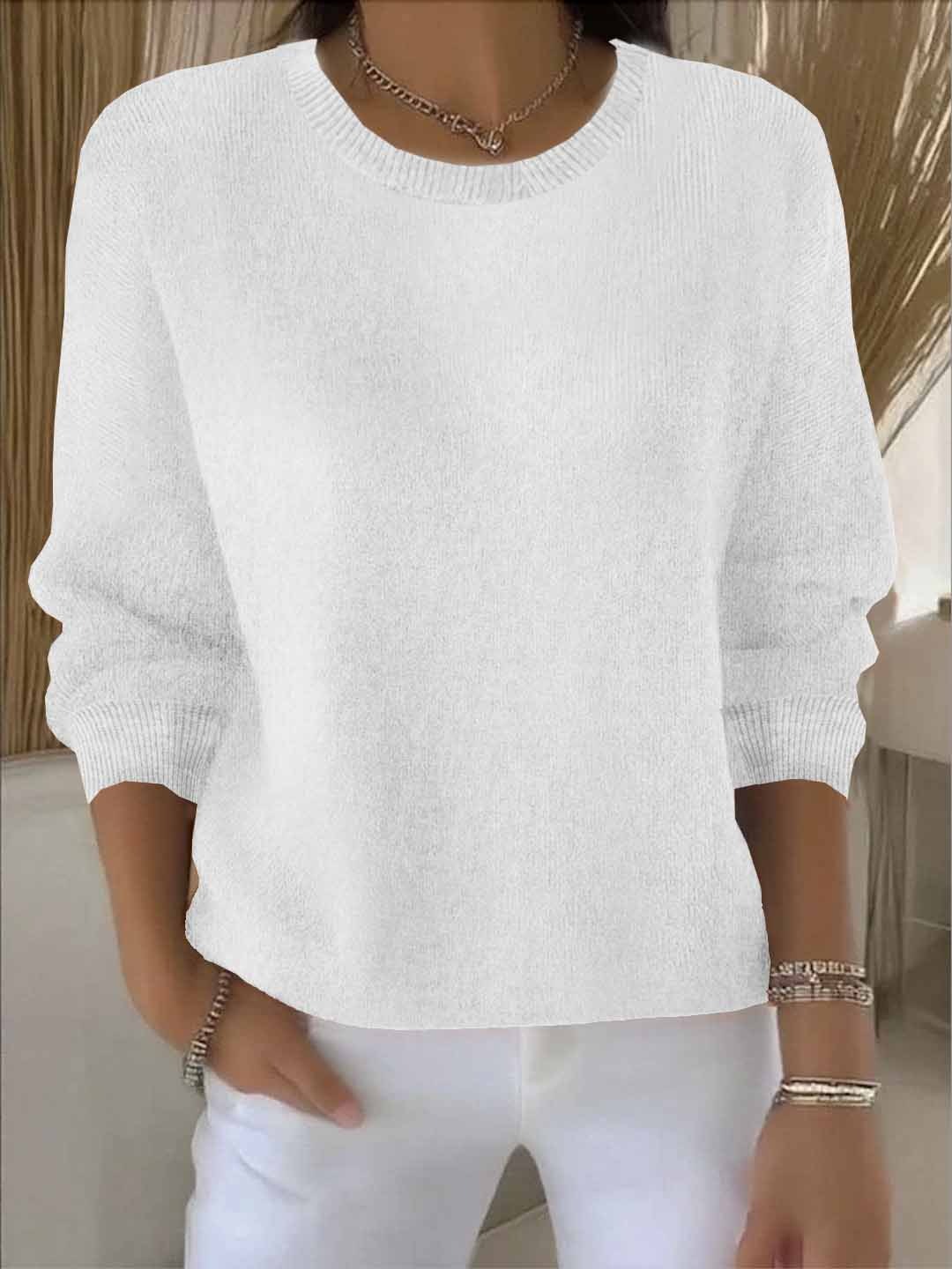 Detailed image of the hem and cuffs of a comfortable loose-fit knit women's spring sweater
