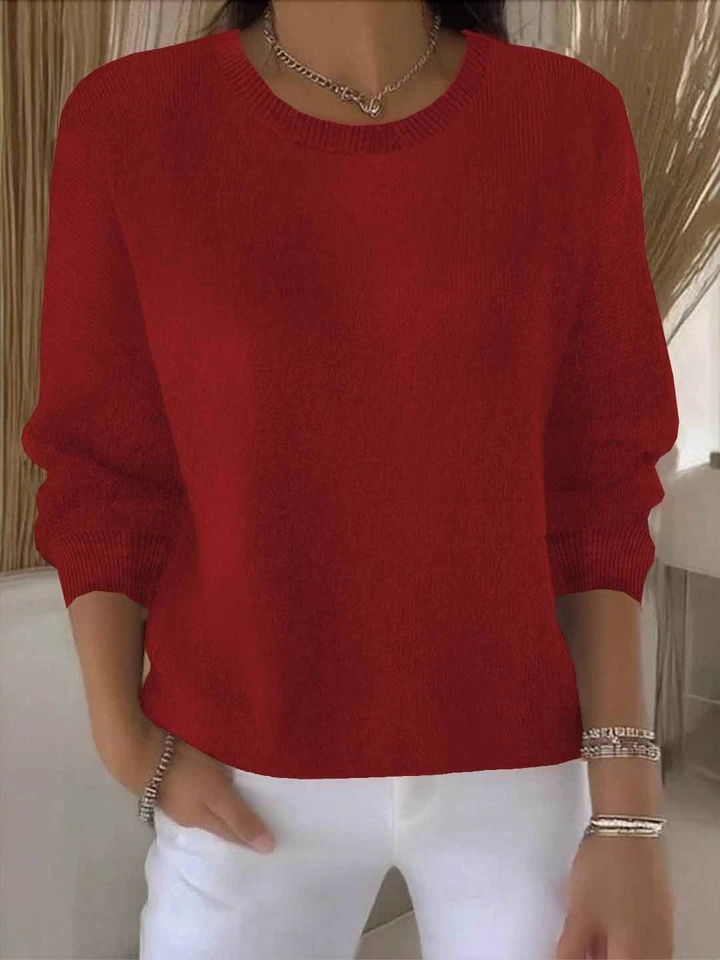 Overhead view of a women's cozy loose-fit spring sweater, highlighting its versatile design