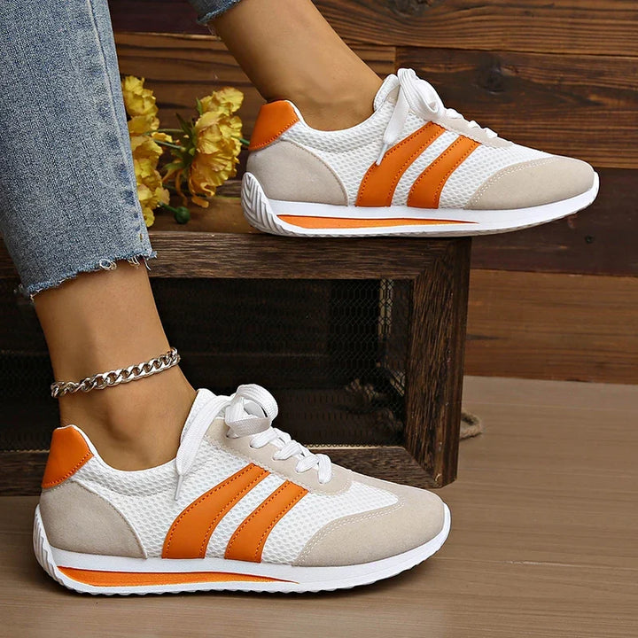 Modern women's low-top lace-up sneakers, comfortable and durable for daily casual wear.