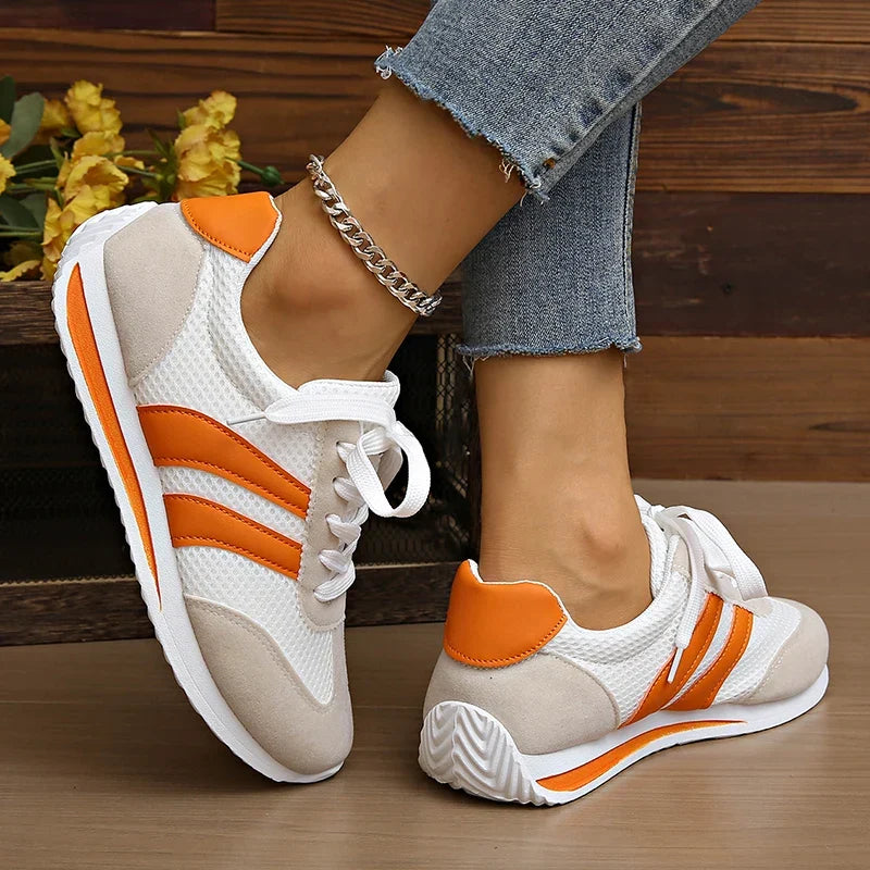 Comfortable orange & purple women's low-top lace-up footwear, ideal for everyday casual style.