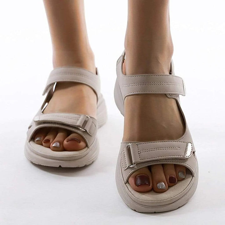 Comfortable women's orthopedic sandals with arch support, perfect for summer walking & foot health. Adjustable fit.
