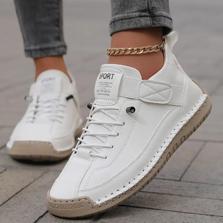 Wide-fit women's orthopedic sneakers with adjustable straps for personalized comfort.