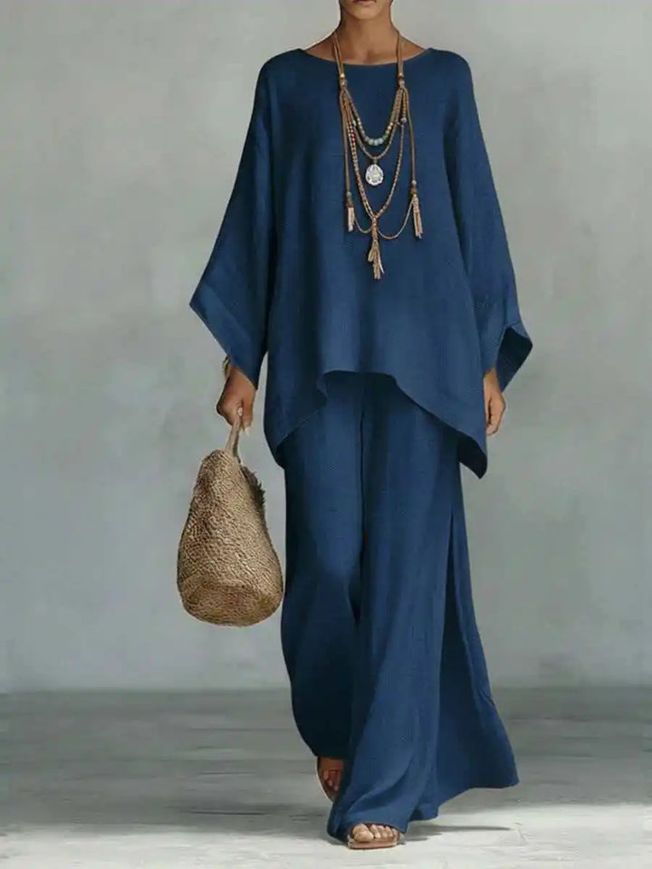 Stylish women's linen two-piece set, featuring a relaxed top & wide-leg pants. Breathable for summer comfort.