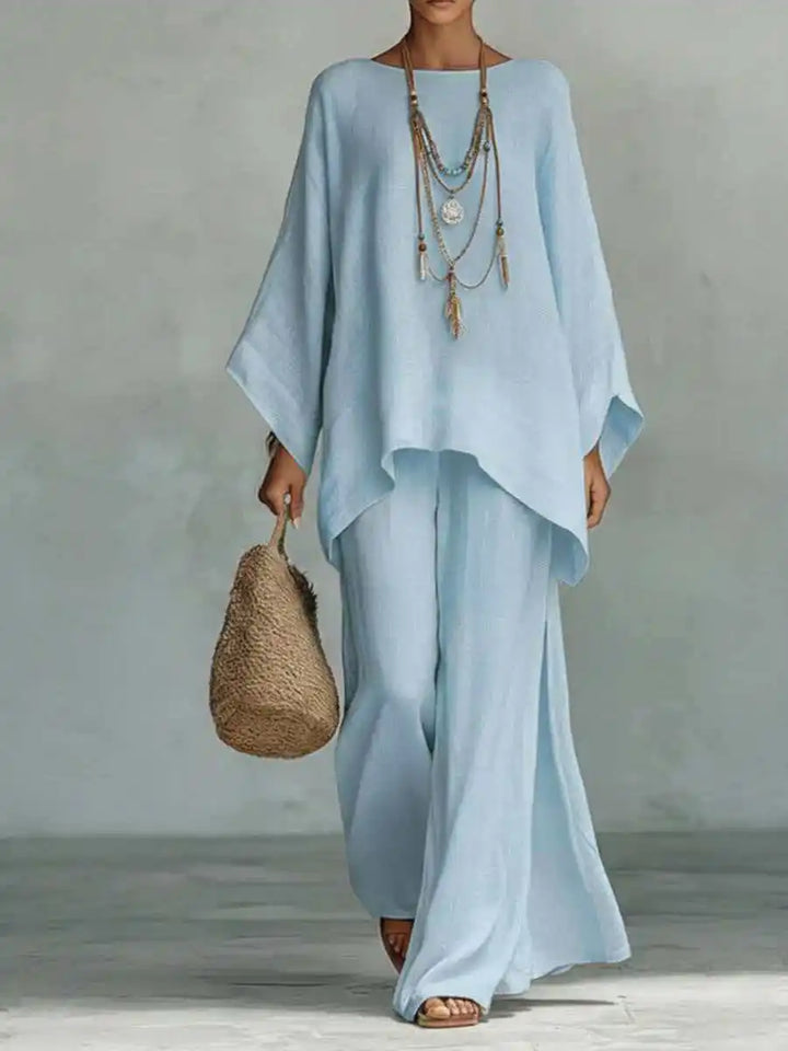 Women's linen two-piece set: relaxed fit top and flowy wide-leg pants, ideal for comfortable summer style.