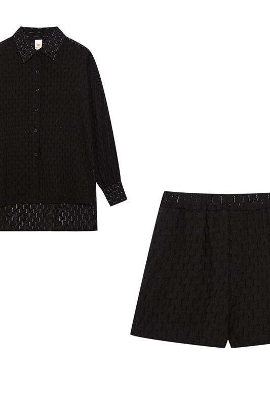 Fashionable women's relaxed fit shirt & shorts set, comfortable for spring & summer daywear.