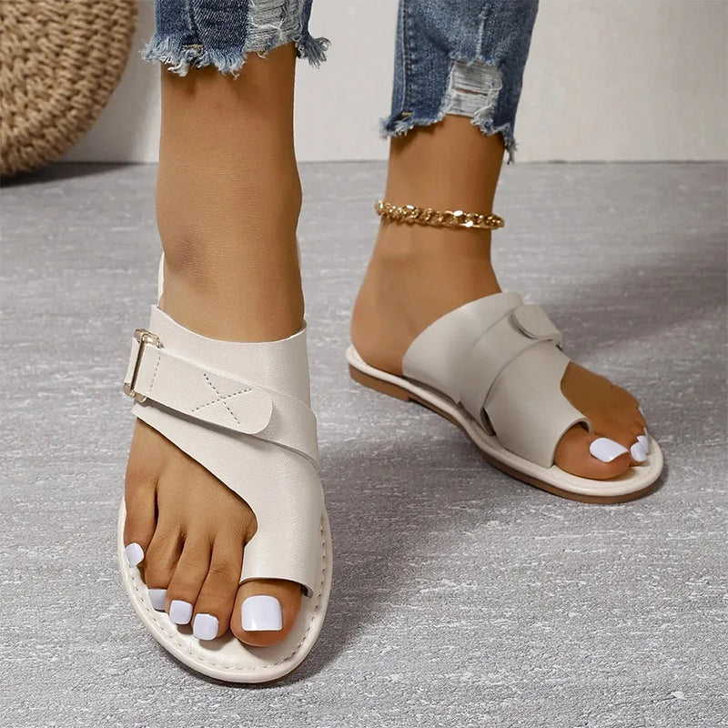 Women's walking sandals: comfortable flat buckle slip-ons. Perfect open-toe summer footwear for casual style.