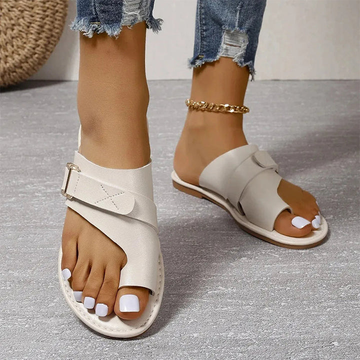 Women's walking sandals: comfortable flat buckle slip-ons. Perfect open-toe summer footwear for casual style.
