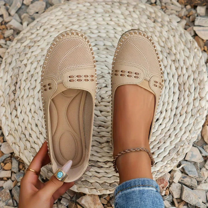 Women's comfortable slip-on loafers, orthopedic support, perforated design for casual everyday wear.