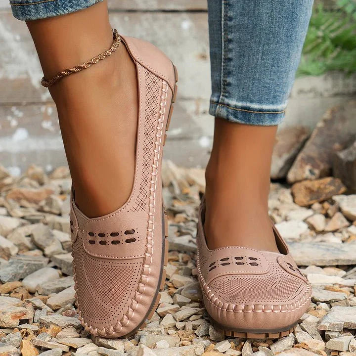 Stylish women's casual slip-on loafers, perforated upper, orthopedic support for comfortable wear.