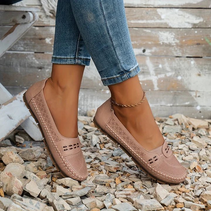 Women's orthopedic slip-on loafers, comfortable and stylish with a breathable perforated design.