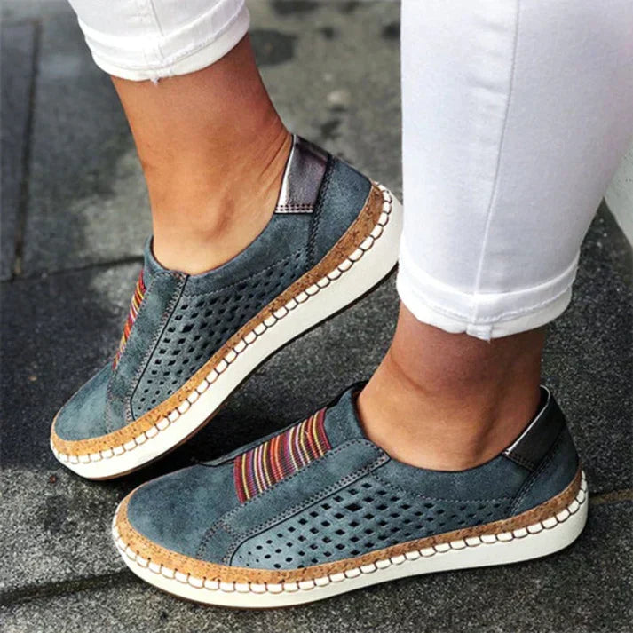 Women's comfortable slip-on walking shoes with breathable perforated design for everyday casual wear.