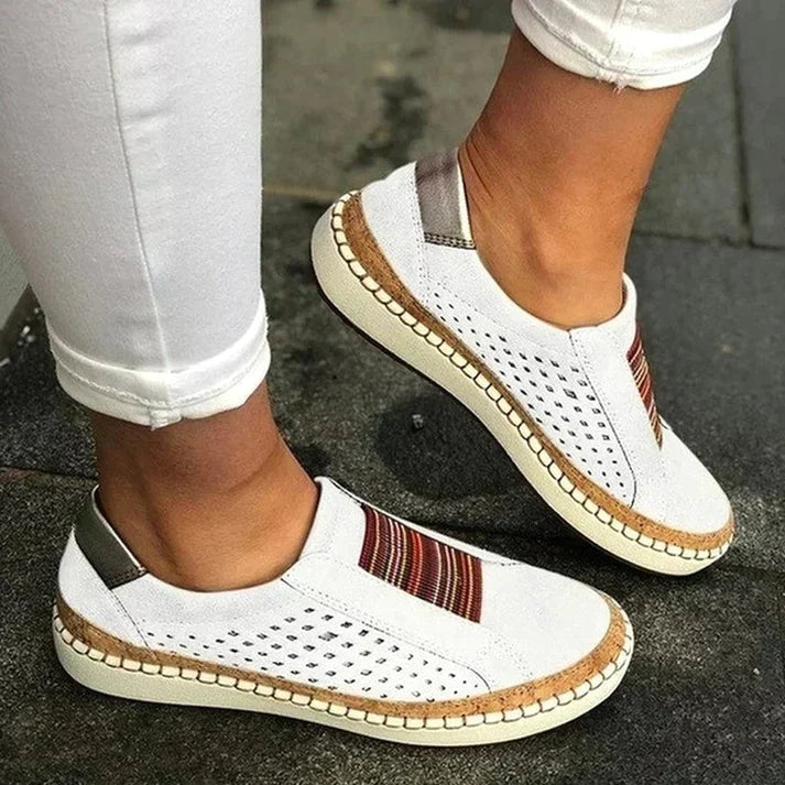 Lightweight women's slip-on walking shoes, easy to wear, offering all-day comfort with breathable perforations.