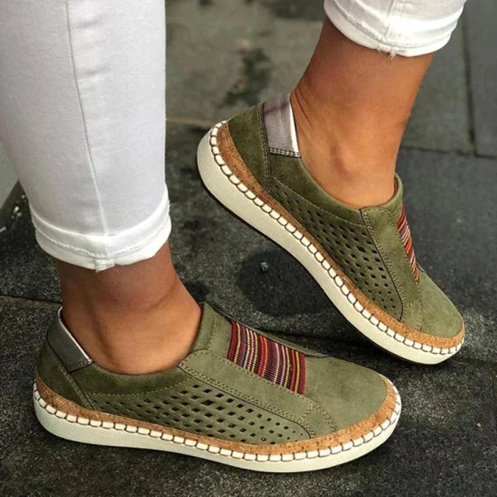 Comfortable women's slip-on walking footwear with breathable perforations, ideal for everyday active lifestyles.