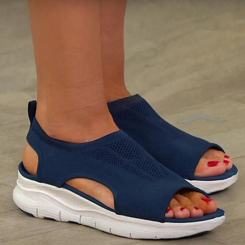 Stylish women's open-toe flat sandals, ideal spring footwear for comfort and casual fashion.