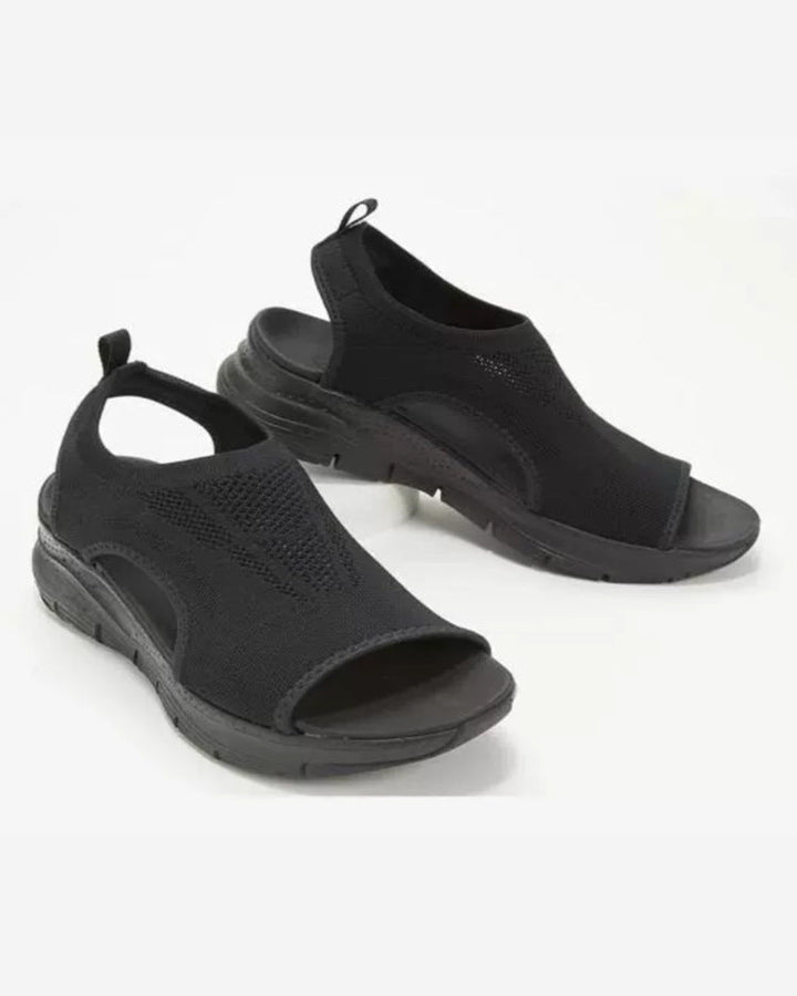 Casual open-toe flat sandals for women, offering comfort and style for spring and summer wear.