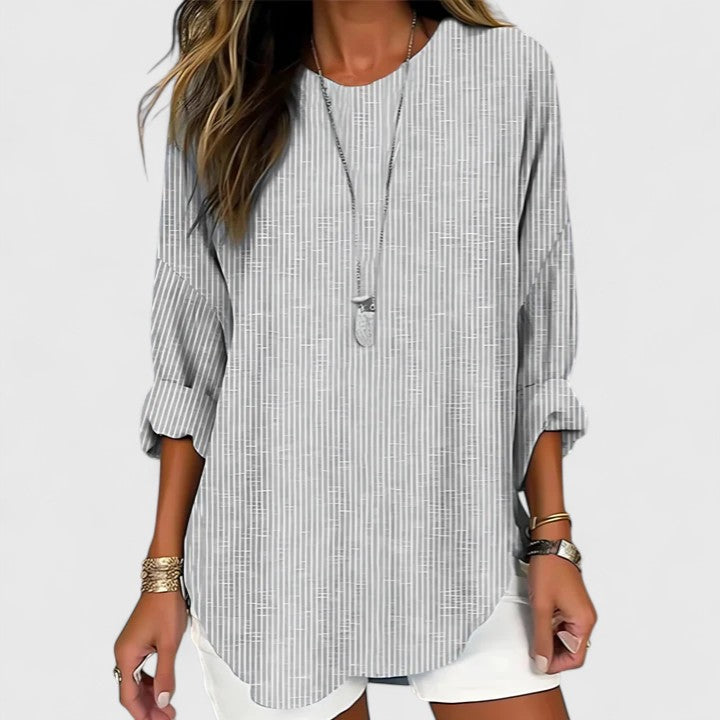 Effortless women's striped crew neck blouse. Comfortable, casual long sleeve top with relaxed fit for versatile styling.