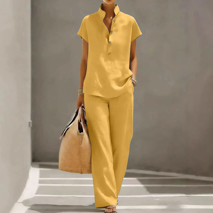 Relaxed women's summer two-piece outfit featuring flowy wide-leg pants and a comfortable short-sleeve top for resorts.