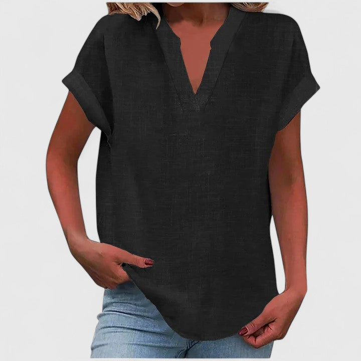 Soft white V-neck women's blouse with short sleeves, a comfortable and chic everyday fashion top for versatility.