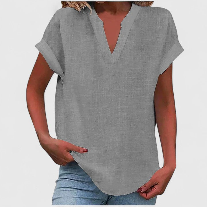 Breathable V-neck women's blouse, comfortable short sleeve top in a vibrant color, perfect for chic casual fashion.