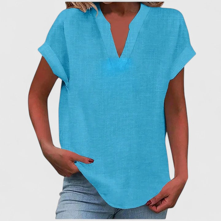 Stylish V-neck short sleeve blouse for women, paired with accessories for a comfortable and elegant look.