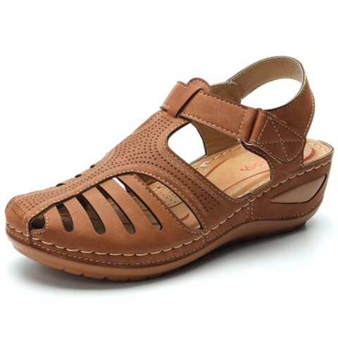 Everyday women's walking sandals featuring a comfortable flat sole and elegant cutout detailing