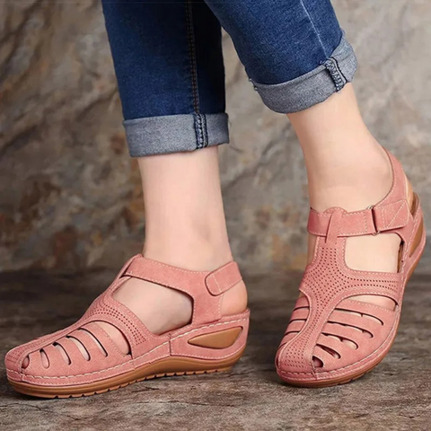 Casual women's sandals featuring intricate cutouts, open toe, and adjustable strap for comfort