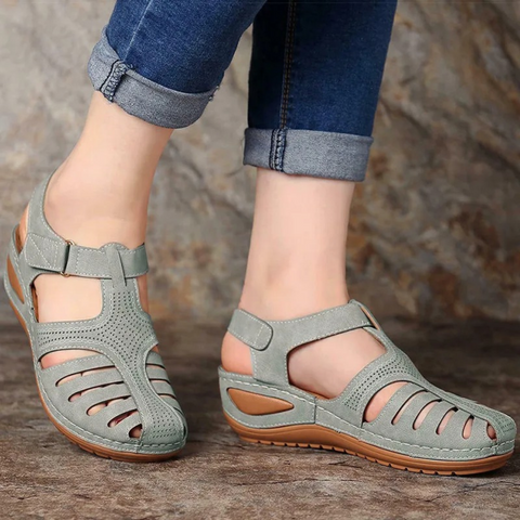 Flat women's walking sandals with a stylish cutout pattern, perfect for all-day wear in summer