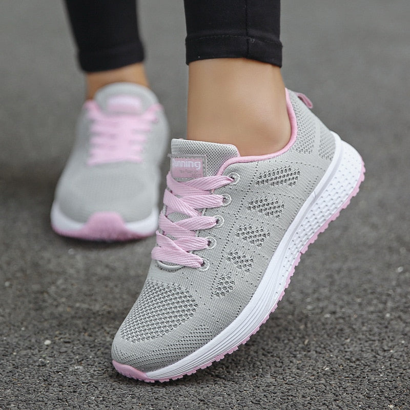 Women's athletic walking shoes with arch support, designed for comfortable movement.