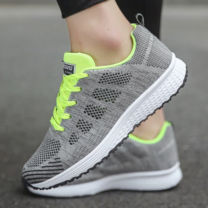 Durable women's walking sneakers, providing essential arch support for long walks.