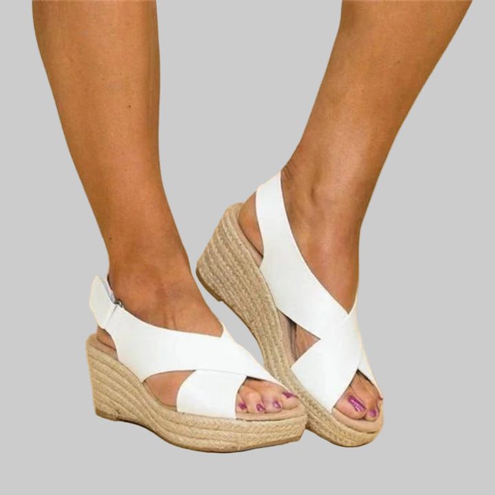 Stylish women's wedge espadrille sandals, new fashion footwear for summer. Comfortable heeled espadrilles for beach or casual.