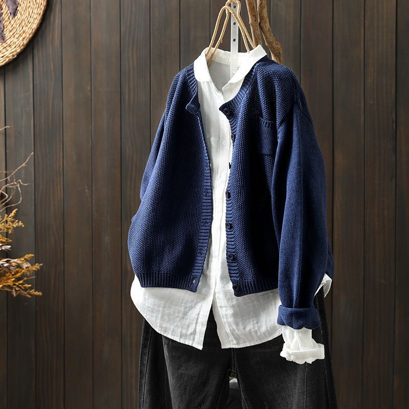 Women's long sleeve knit cardigan in a relaxed fit, featuring elegant button details and soft fabric.