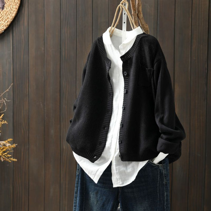 Cream colored knit cardigan, a comfy and versatile layering piece with stylish buttons for women.