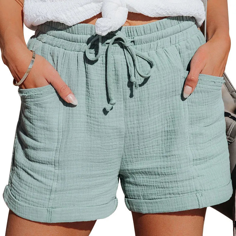 Above knee women's shorts with an elastic waist & drawstring closure. Essential comfy pocket shorts.
