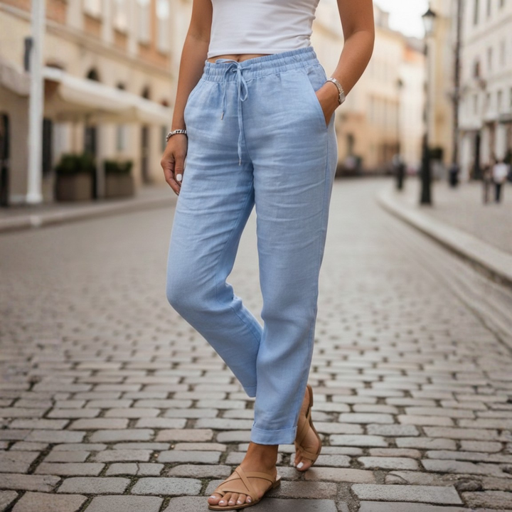 Women's elastic waist tapered pants with drawstring & pockets, offering ultimate summer comfort.