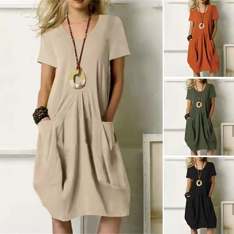 Women's comfy summer swing dress with short sleeves and pockets. Perfect knee-length casual everyday wear.