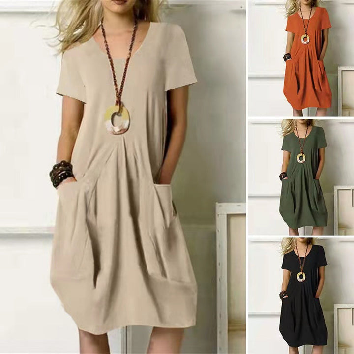 Women's comfy summer swing dress with short sleeves and pockets. Perfect knee-length casual everyday wear.