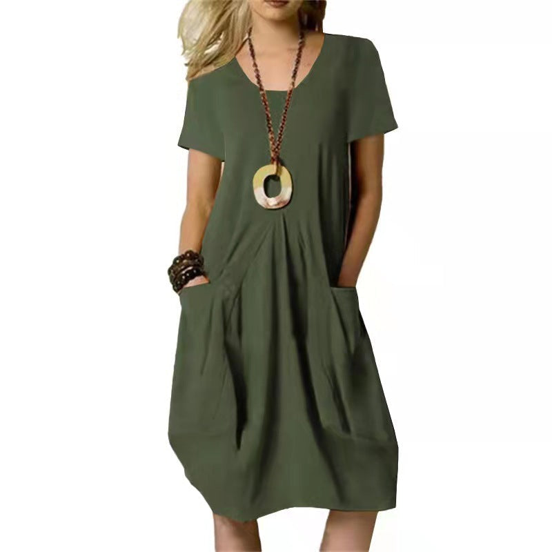 Versatile knee-length summer swing dress for women, featuring practical pockets & comfy short sleeves.