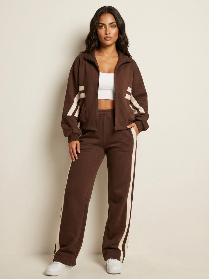 Women's contrast stripe zip-up tracksuit set. Sporty matching outfit with wide leg pants for comfort.