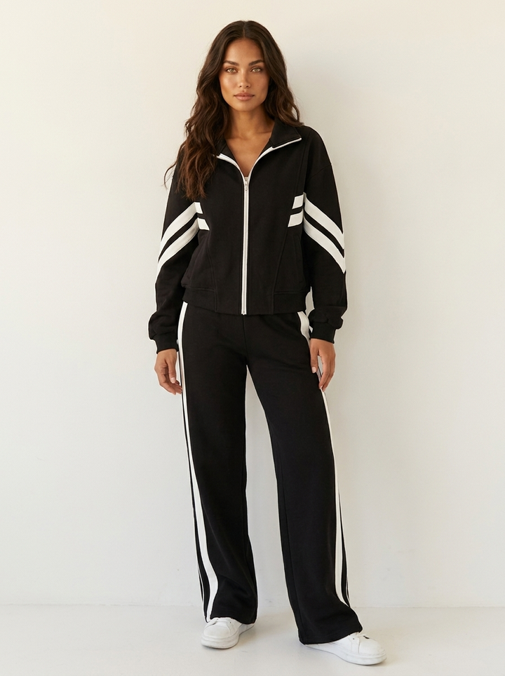 Comfortable women's wide leg tracksuit pants with contrast side stripes. Ideal for loungewear.
