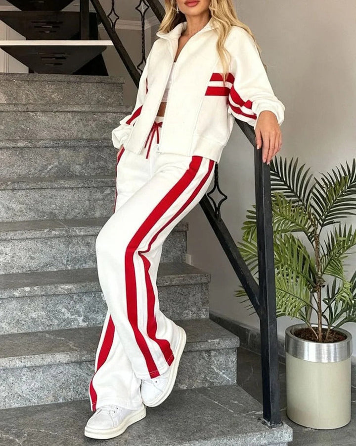 Trendy women's contrast stripe tracksuit. A comfortable zip-up jacket & flowy wide leg pants for daily wear.