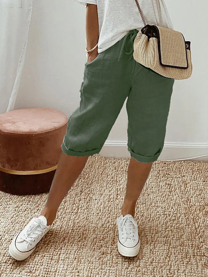 Stylish women's drawstring cotton capri pants with a roll hem. Ideal for casual wear, summer, & everyday comfort.