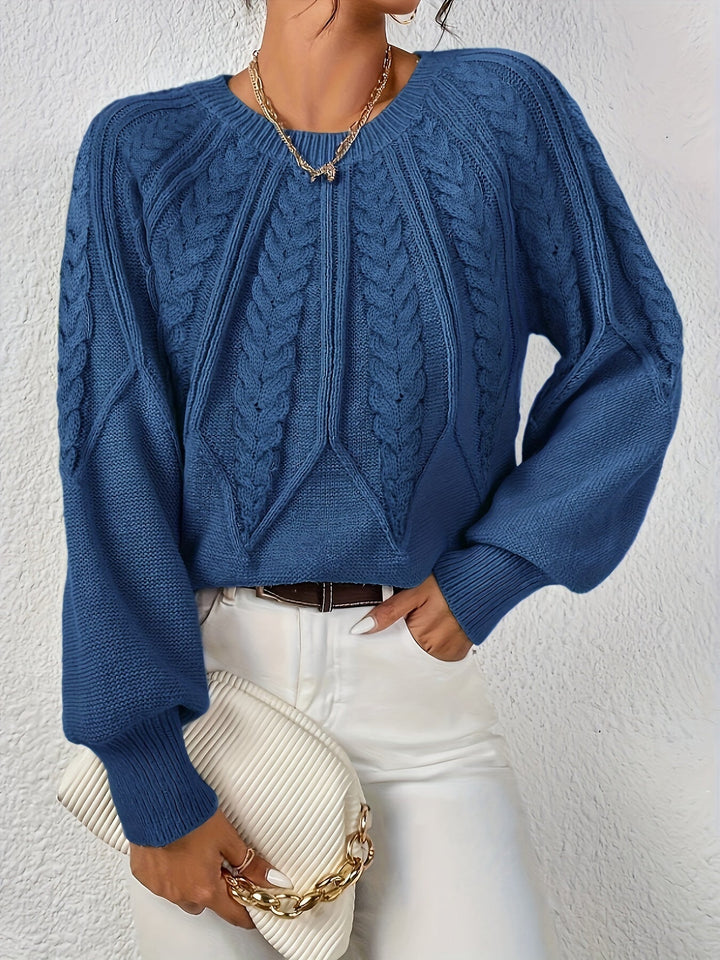 Stylish women's relaxed fit cable knit top, perfect for everyday casual elegance.